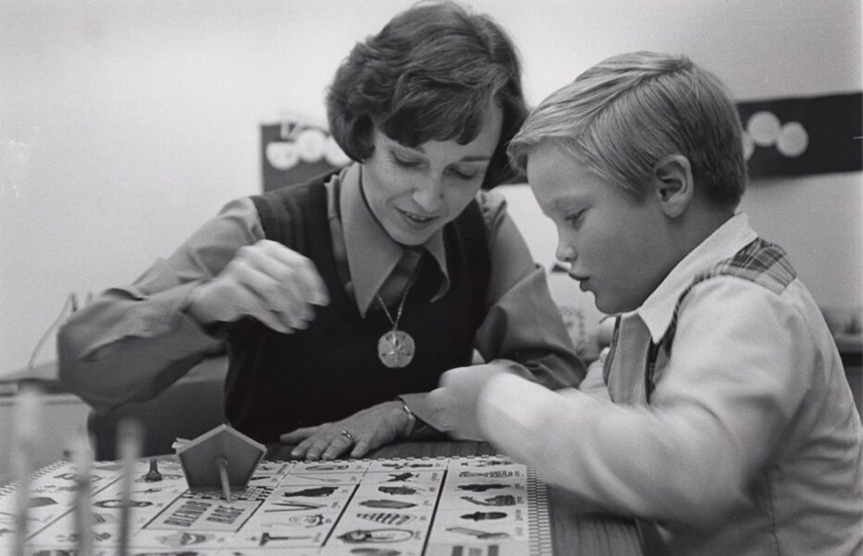 Photograph of Marilyn Hosington, graduate student in special education, tutoring Jeff Carette of Guatemala at the Diagnostic Education Center at the University of Houston at Clear Lake City in November 1976.