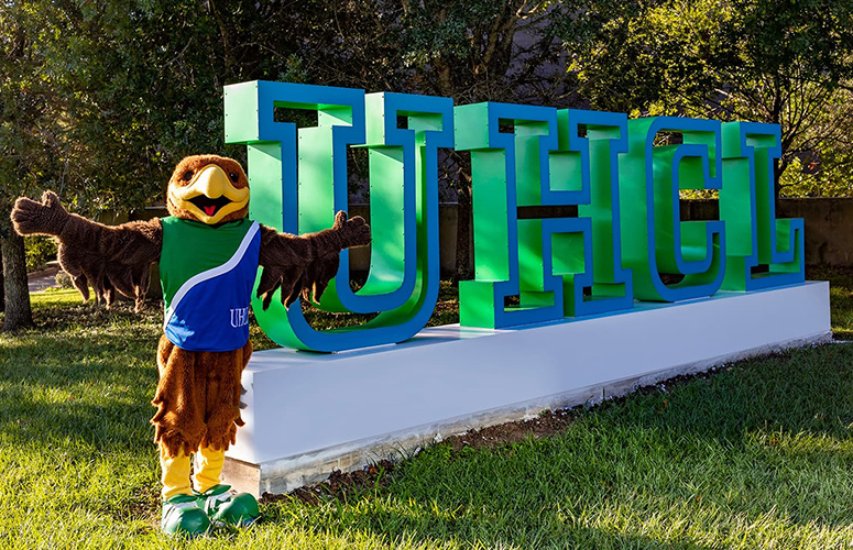 Photograph of UHCL Letters with Hunter.